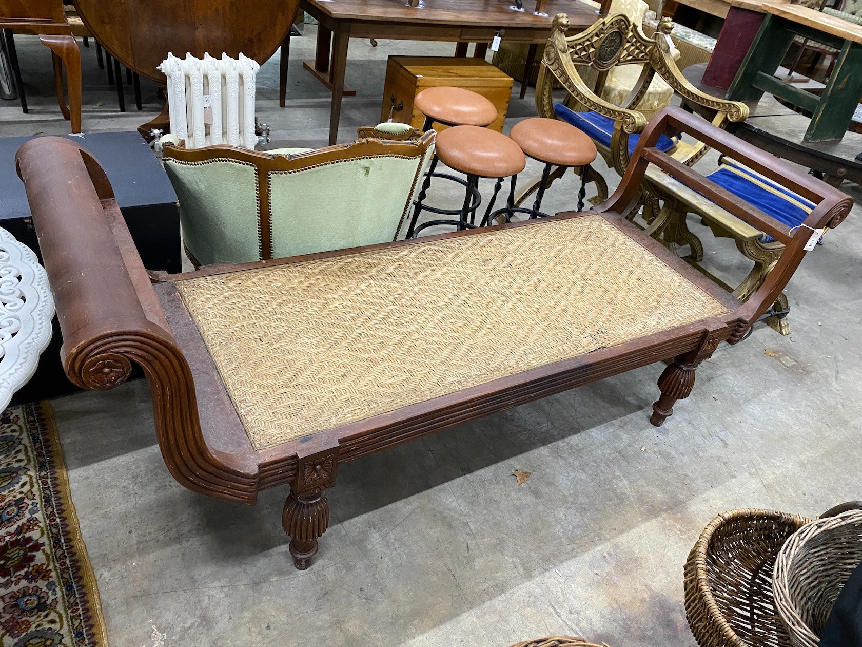 An Indonesian caned hardwood daybed, length 212cm, depth 71cm, height 84cm